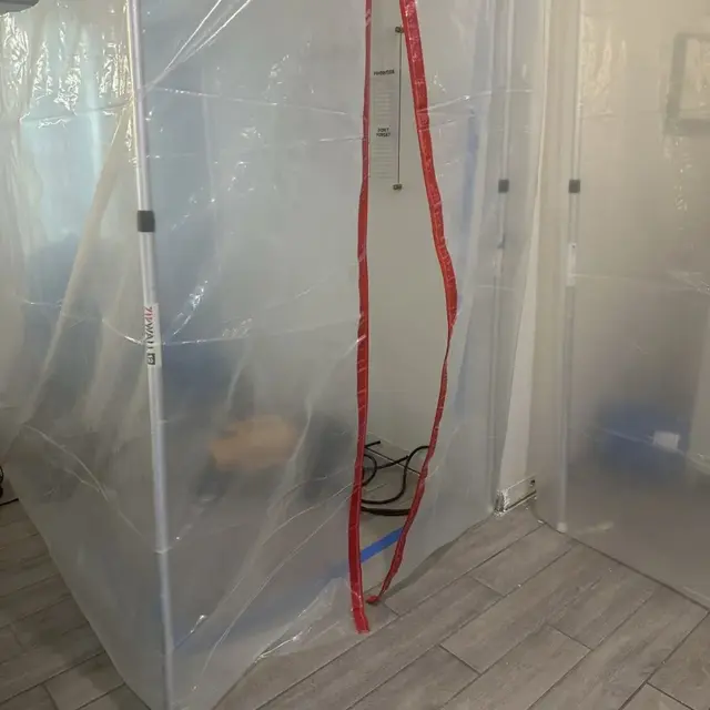 Plastic containment set up during a water damage cleanup in a Lutz, FL home