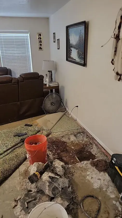 Floor broken open to reach a slab leak in a Lutz, FL home